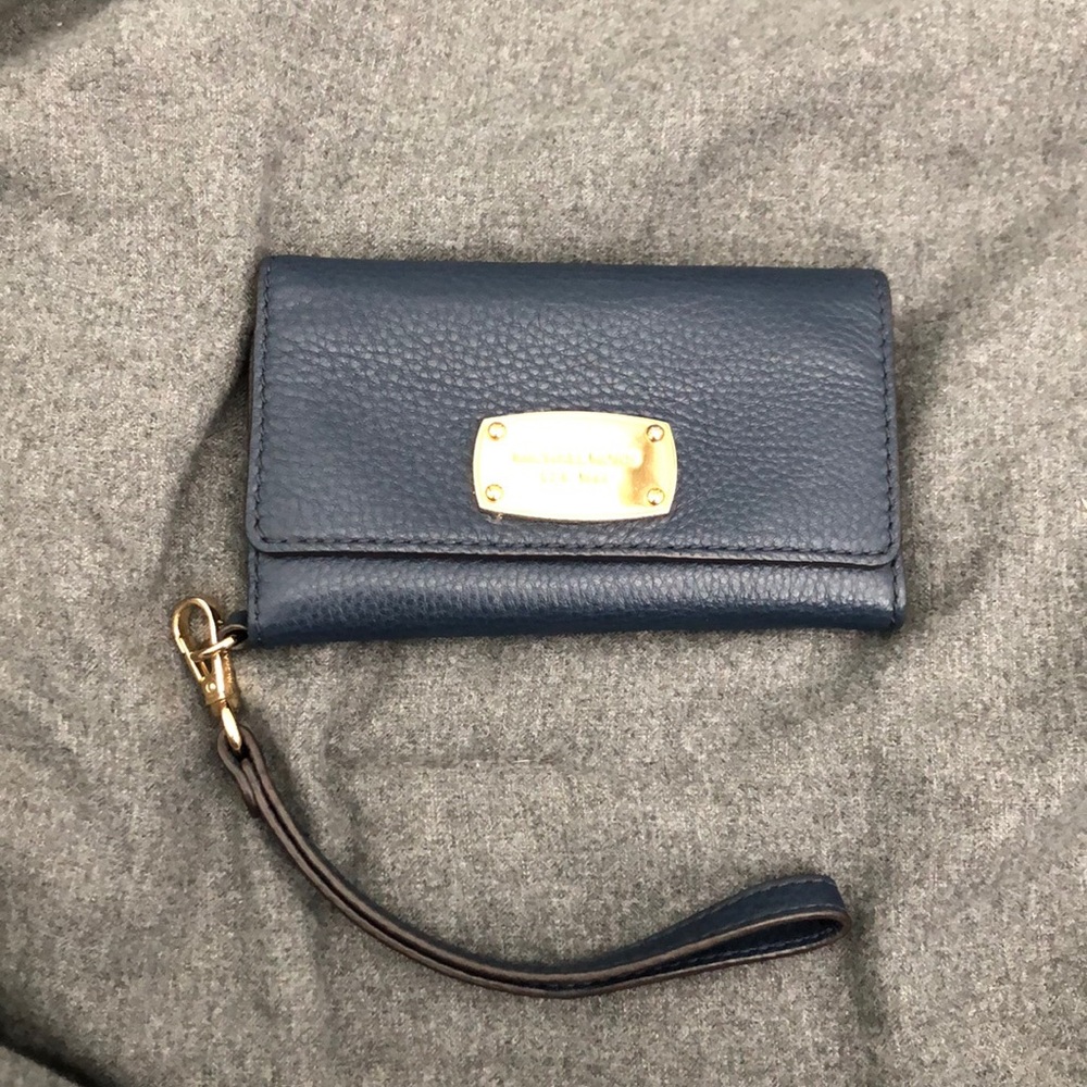 Authentic Michael Kors iPhone 6 case and wristlet.